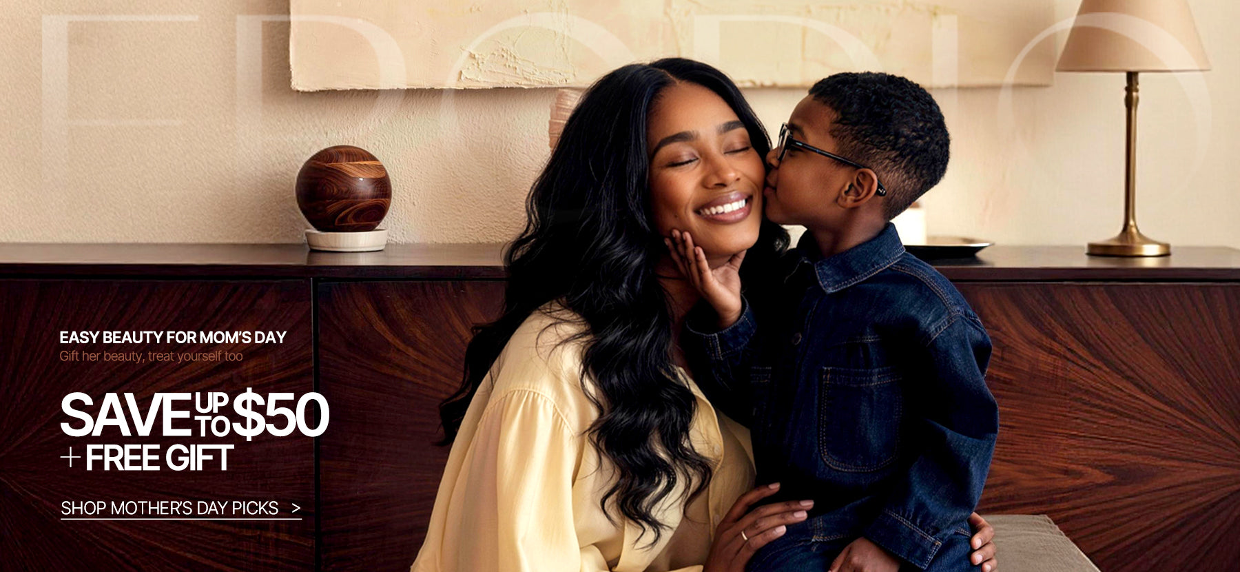 Woman and child embracing with promotional text for Mother's Day savings.